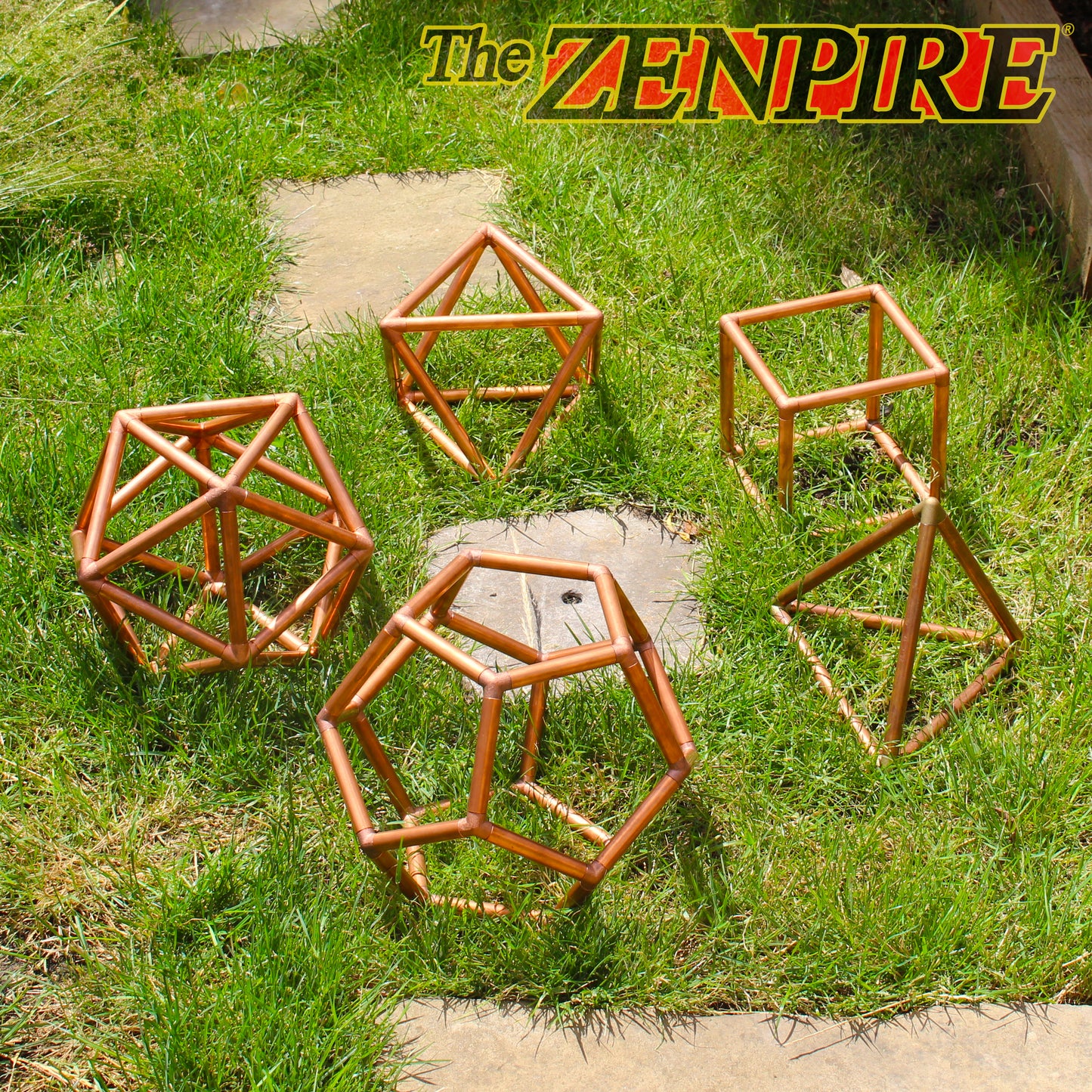 all 5 copper platonic solids connector piece kit made from copper pipe and copper connector pieces laid out on the grass