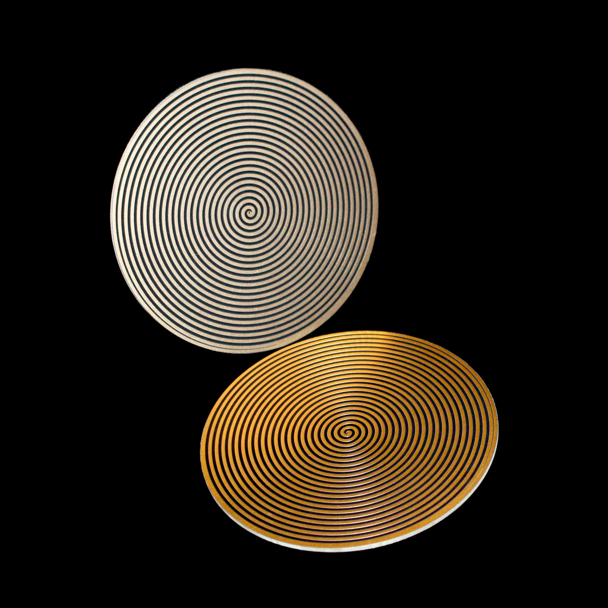 two circular sacred spiral healing disks facing each other