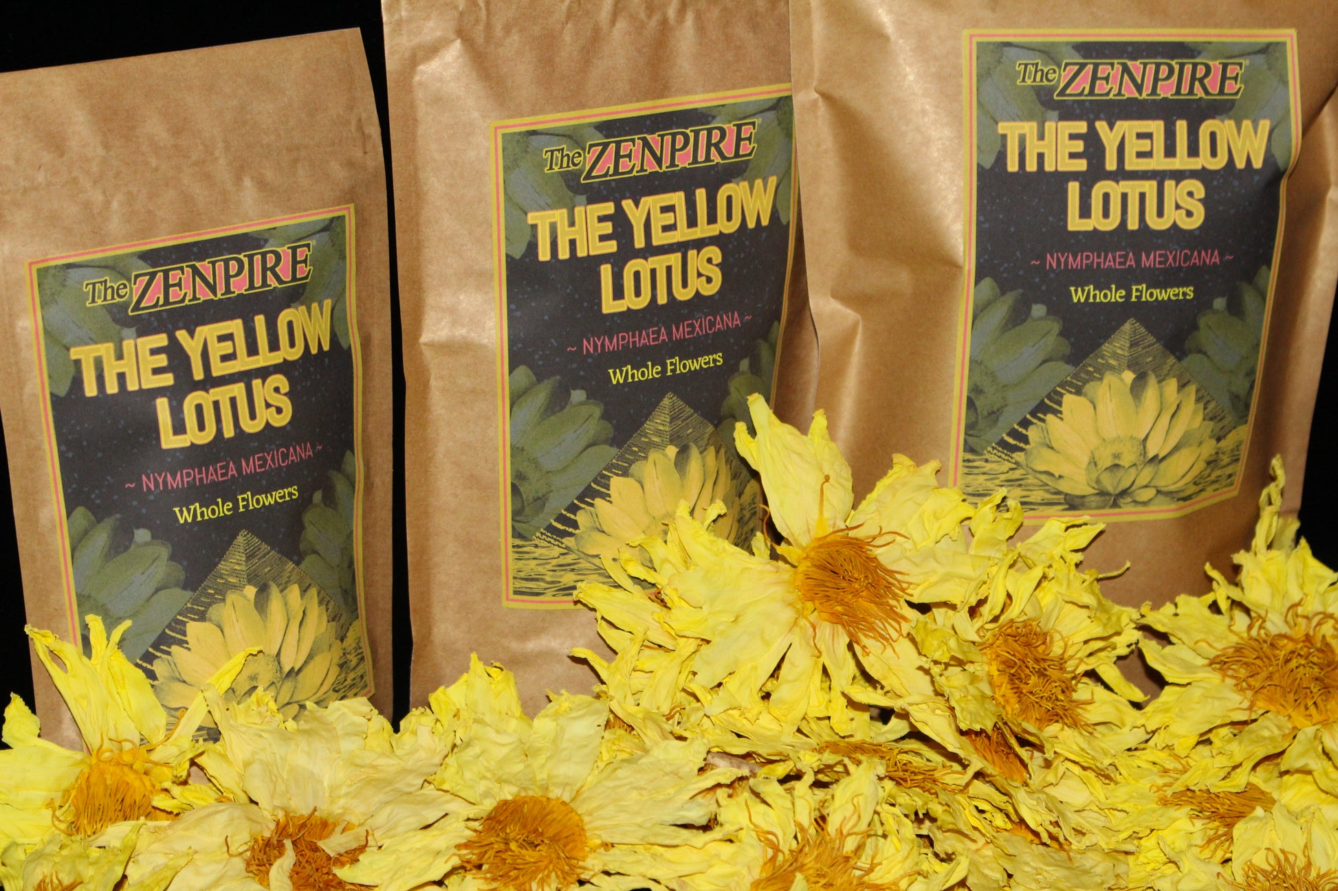 Three packages of 'The Yellow Lotus' with yellow flowers in front
