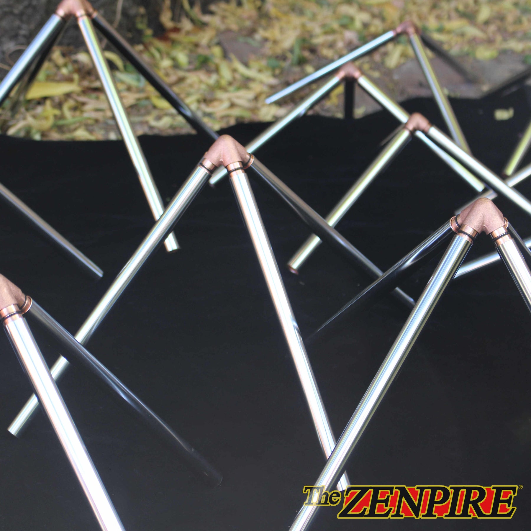 chrome pipes and connector pieces that are used to create a large cube octahedron sacred geometric pyramid meditation form
