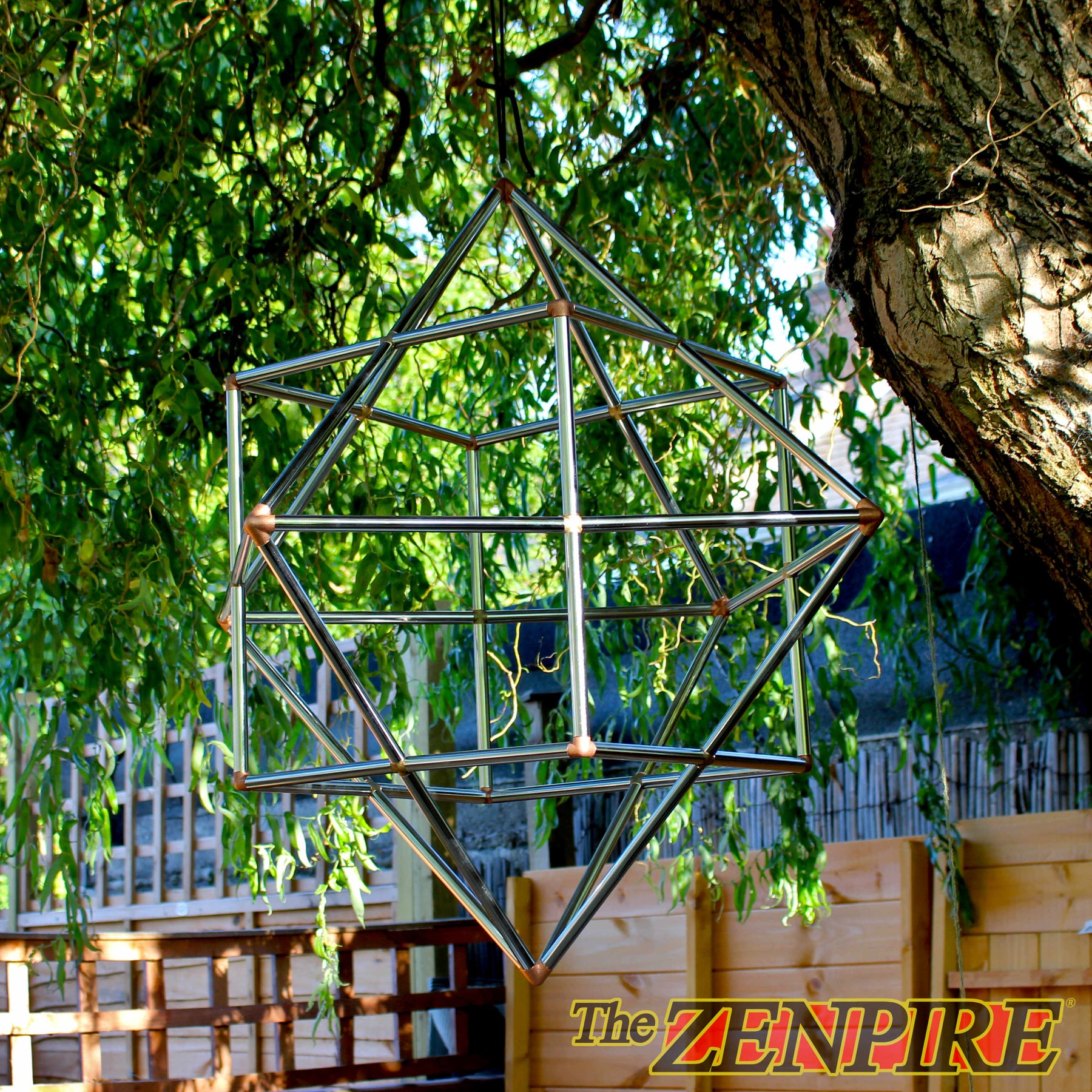 A geometric metal hanging structure made of intersecting silver rods forms a cube octahedron for self healing.