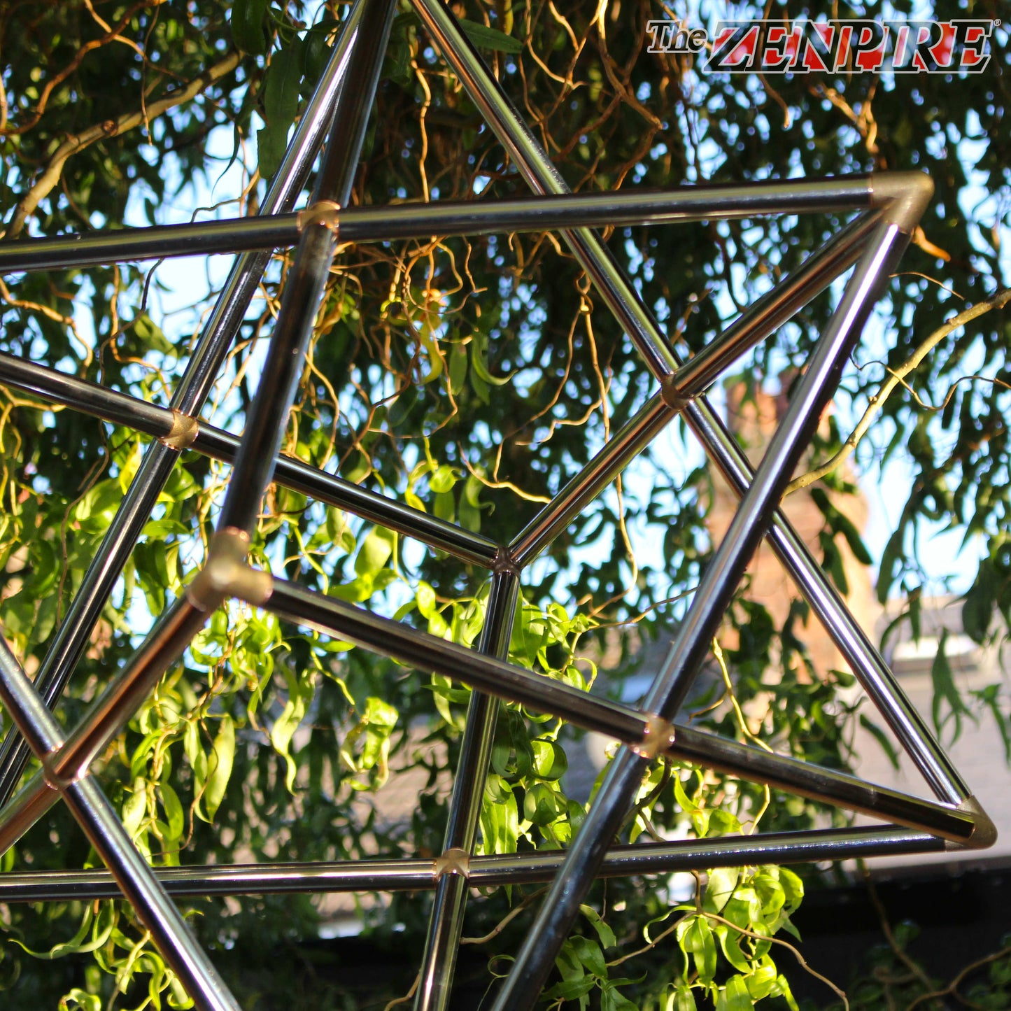 stunning chrome plated copper pipe geometry kit of merkaba tantric star  hanging from a tree
