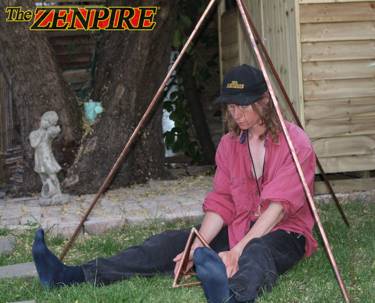 person connecting with copper healing tetrahedron and pyramid tools 