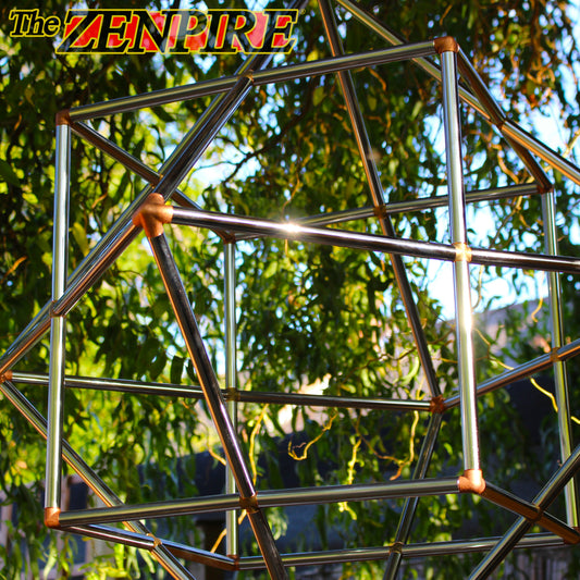 chrome copper cube octahedron healing tool hanging with a forage background