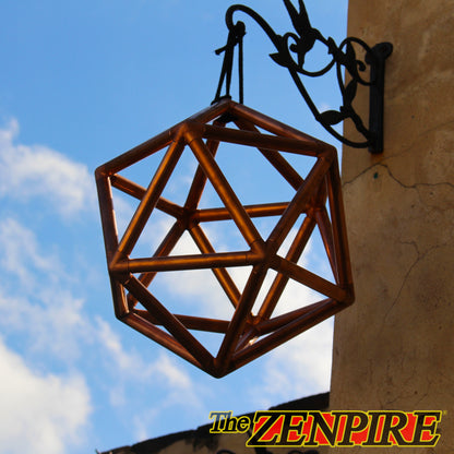 a copper icosahedron sacred geometry kit hanging outside