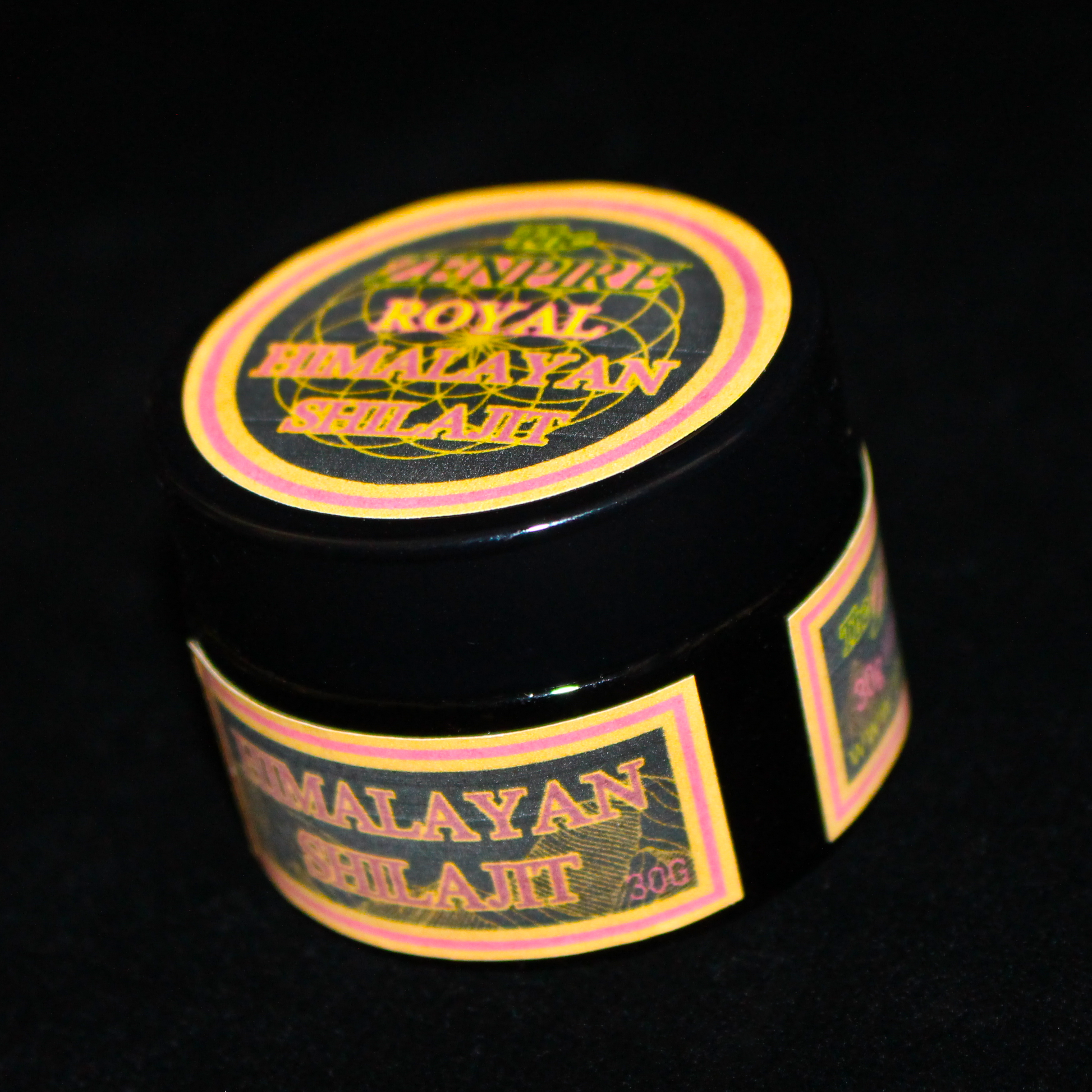 A black jar of golden grade Himalayan Shilajit.