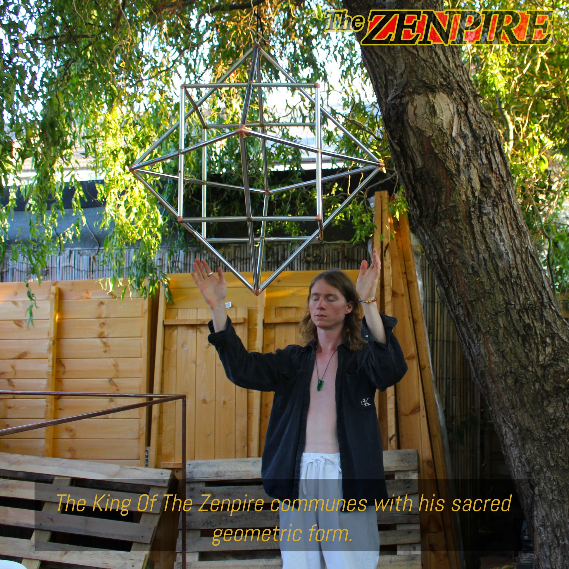 A person (the king of The Zenpire) meditating with his sacred geometric cube octahedron for healing.