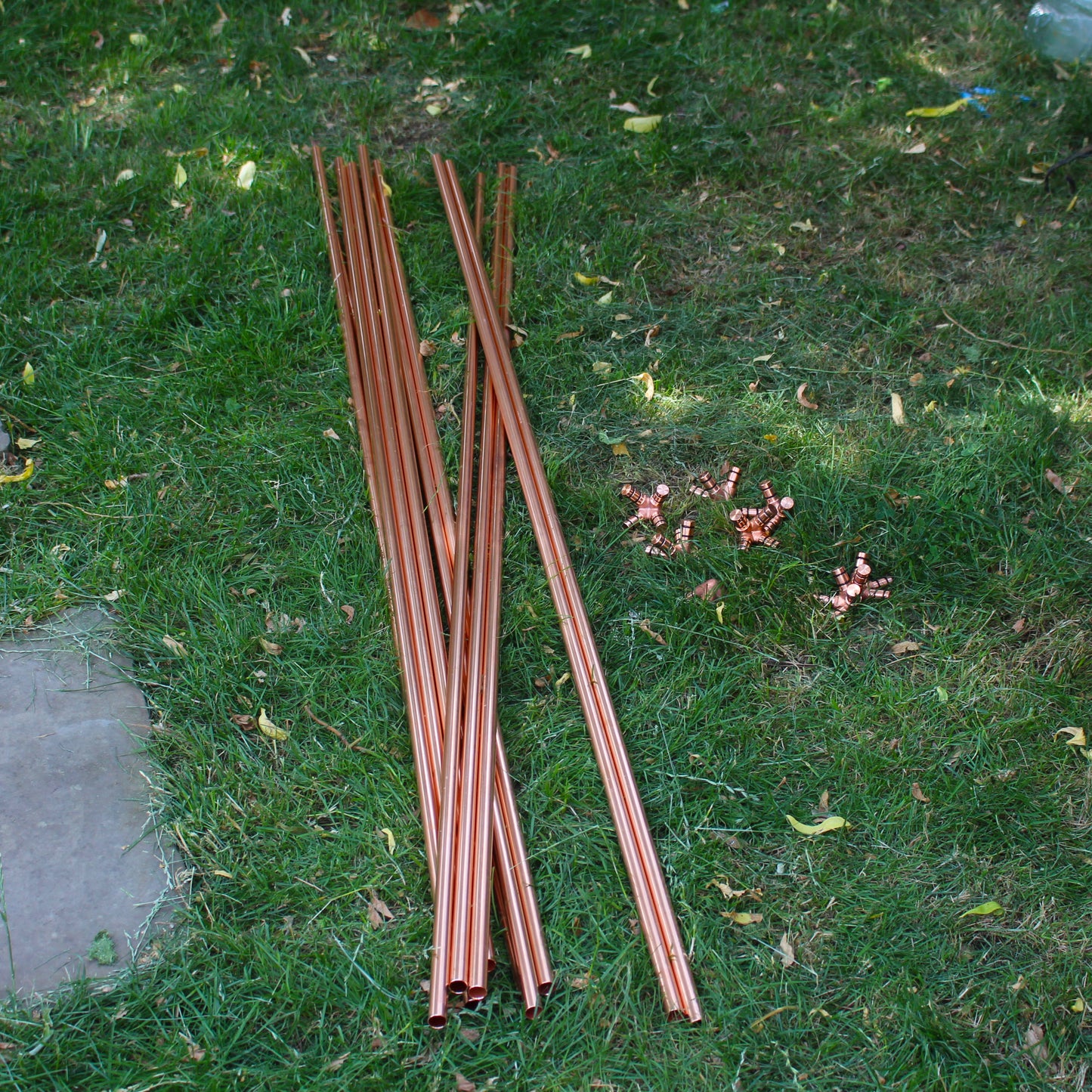 copper pipes and copper connector pieces used to assemble large copper octahedron pyramid healing system.