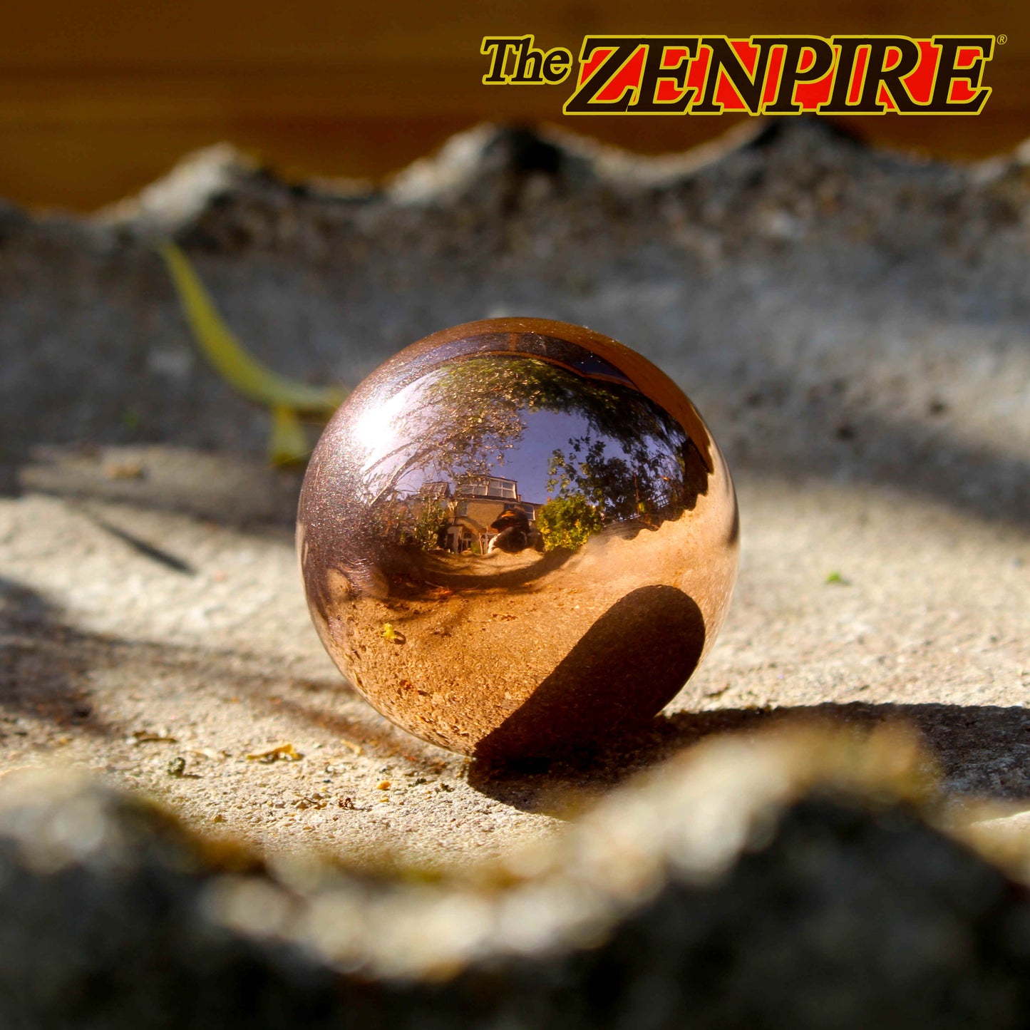solid 50mm copper sphere resting on a birdbath